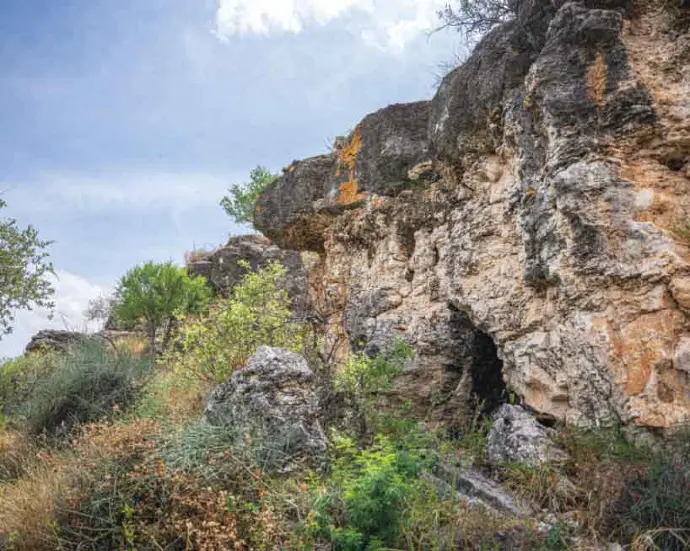 Rocky outcrop with a small cave
